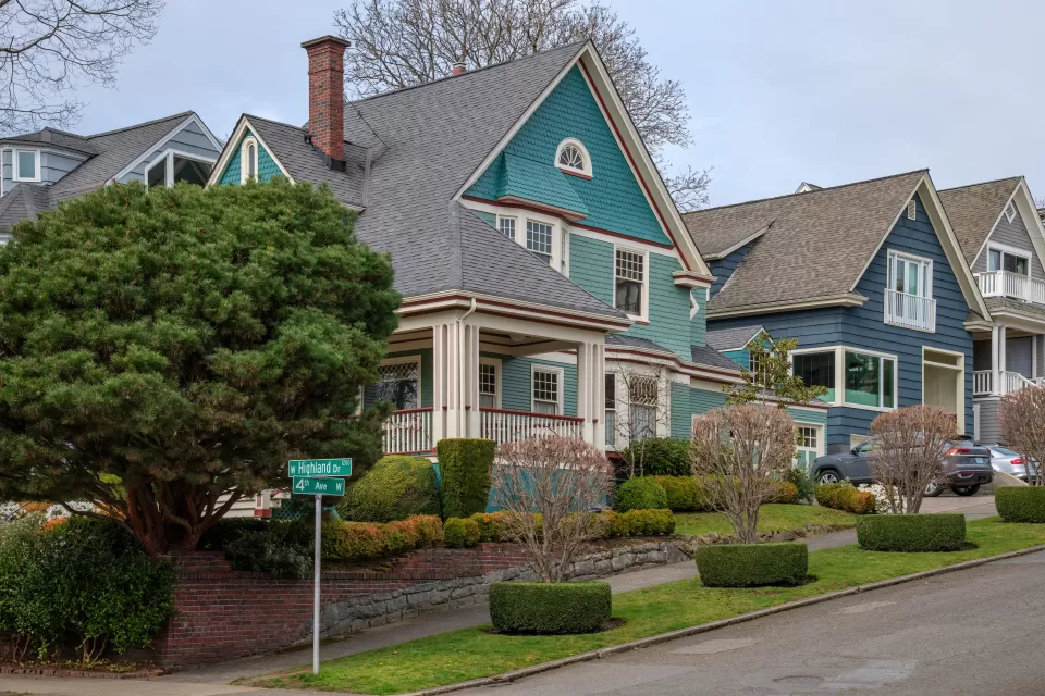 Teal and blue two-story houses in Seattle's historic Queen Anne neighborhood